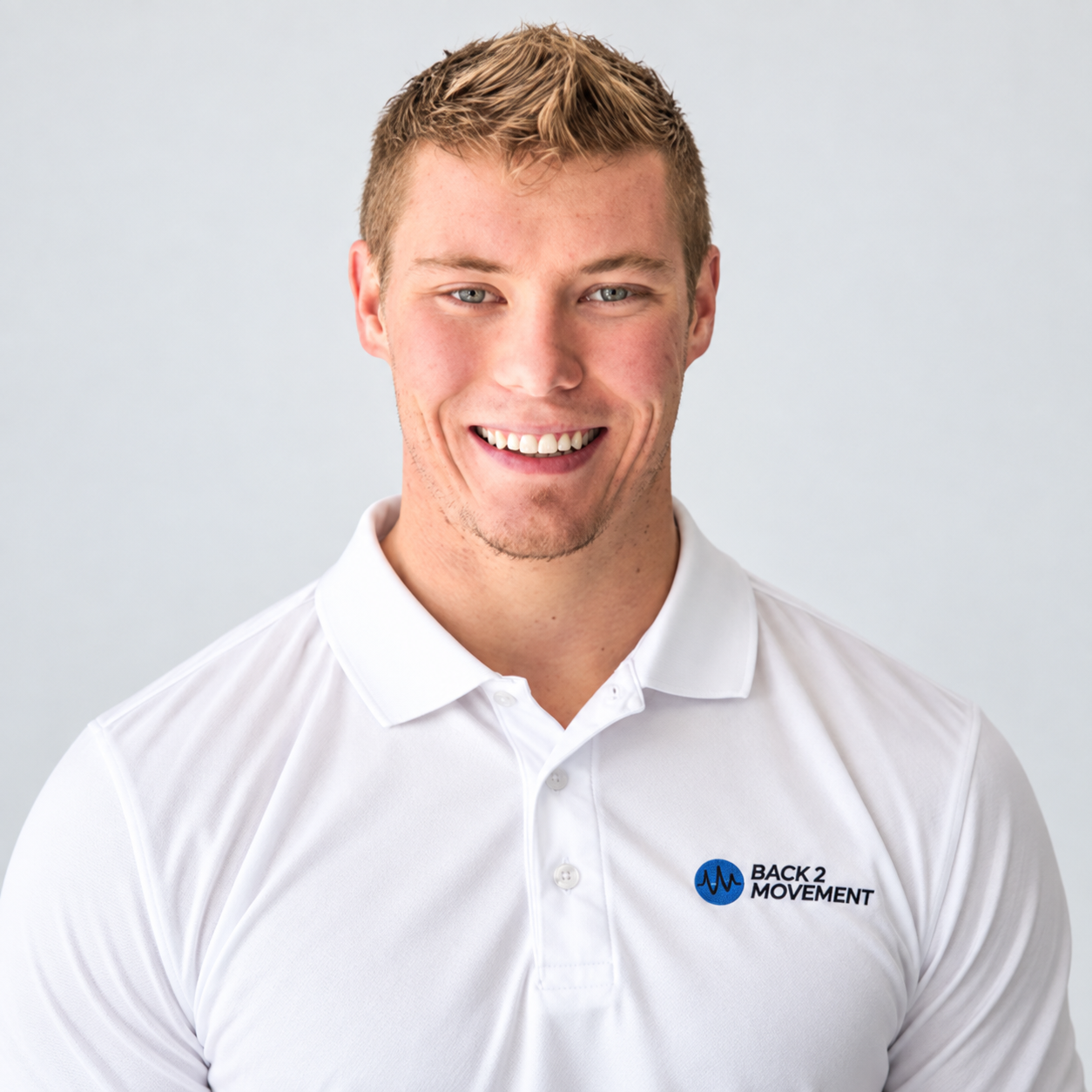 Dr. James Westover smiling in a Back2Movement polo